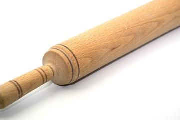 Wooden rolling pin closeup on a white background