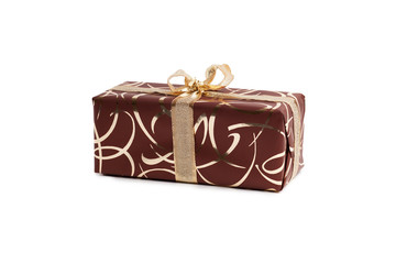 packaged rectangular gift in dark brown packaging with gold bow and gold pattern on the white background