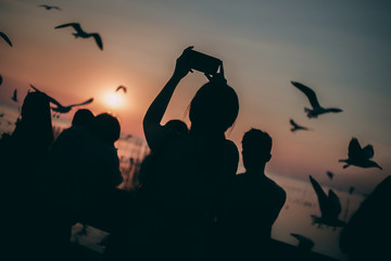 Silhouette of the sea on sunset background of the sky