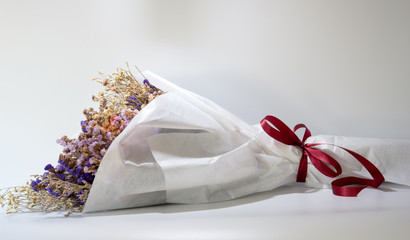 Beautiful white dry bouquet colorful mix flower in white background