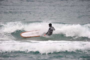 Korean Winter surfers at the Buheung-ri beach in Namjeong-Myeon, Yeongdeok-gun, South Korea.