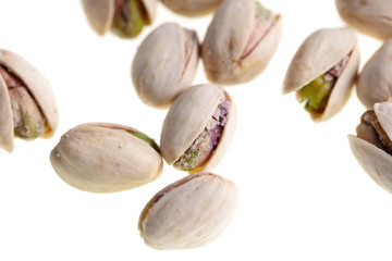 Ripe pistachios nuts isolated on a white background