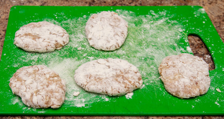 Cutlets on a green board in the kitchen