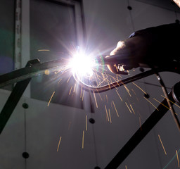 sparks from metal welding at a construction site