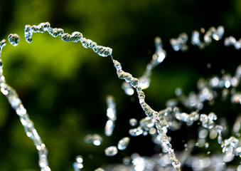 Water splashing from a fountain on summer nature