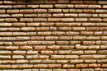 Part of the brick wall in the old town. Different bricks, whole and slightly broken. Part 3