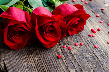 Red roses flowers with red hearts