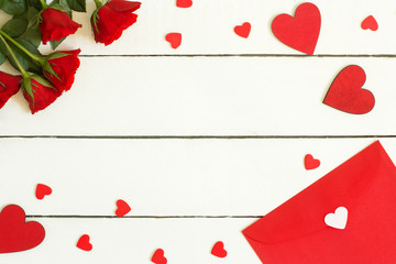 valentines day composition with roses and hearts on white wooden background