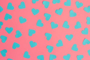 Valentines composition , blue hearts on pink background