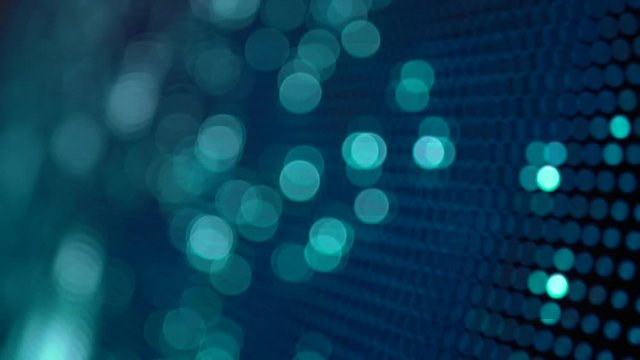 Closeup LED display with color shades technology,  blurred flashing discotheque lights, abstract pixels bokeh