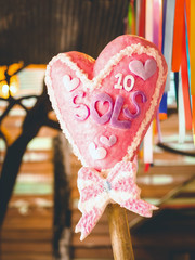 Artificial candle decorated with heart shape to represent the symbol of love and celebrate the...