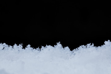 snowdrift, snow texture solated on a black background, cold, fluffy snowdrift