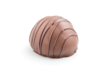 Single chocolate candy isolated on white background. side view.