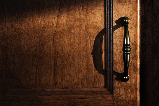 Kitchen Cupboard Door Handle In Warm Sunlight