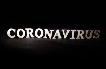 Word coronavirus on a black background. Deadly viral disease concept, medicine and vaccine for virus, dangerous