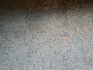 The floor is made of rough gray stone slabs