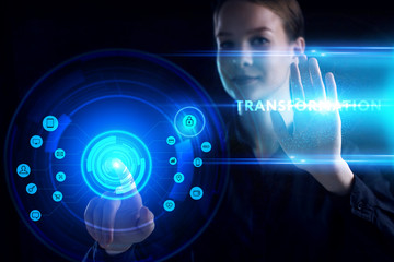 Business, Technology, Internet and network concept. Young businessman working on a virtual screen of the future and sees the inscription: Transformation