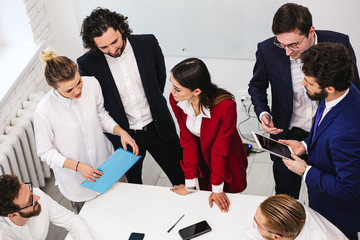 business co-working of friendly team in office, wearing formal wear, communicate with partners, co-workers, colleagues. Togetherness and joint work in office