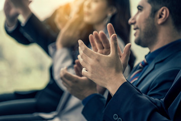 Group of employees sitting and listened to the meeting and applauded their congratulations in the company's seminar room.