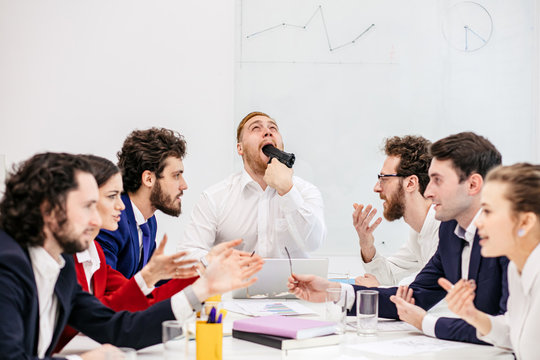 Business Meeting Of Young Caucasian People, Having Trouble At Work, Tired Of Swearing Colleagues, Depressed And Angry On Each Other, Isolated In Modern Meeting Office Indoors