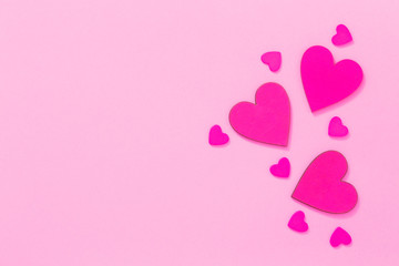 Valentines card with pink hearts on pink background