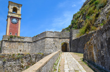 Fototapeta na wymiar Clock Tower at The Old Fortress of Kerkyra (Corfu Town), the capital of Corfu island, Greece.