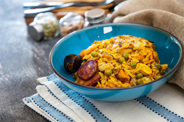 Paella with chicken, seafood and chorizo