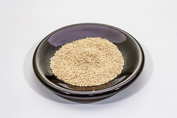 Dashi, traditional Japanese seasoning isolated on white background. Indispensable ingredient for cooking soup stock. Finished dry granules