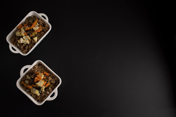 Buckwheat porridge on a dark background, russian national dish, top view