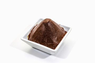 Dark brown miso paste isolated on white background. Traditional Japanese seasoning, indispensable ingredient for cooking soup stock