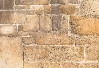 sandstone wall worked by a stonemason