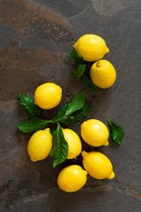 Fresh lemons with leaves, vitamin c concept, top view