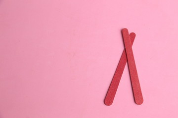 Nail file on colorful background