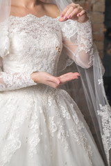 a woman throws wedding rings in the air. Wedding. Celebration. Wedding ring.