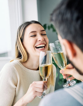 young woman gorl couple toasting champagne happy