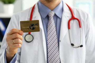 Male GP holding banking card in arm