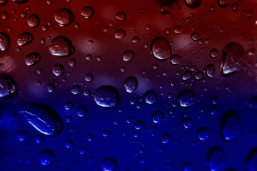 water drops on blue red background
