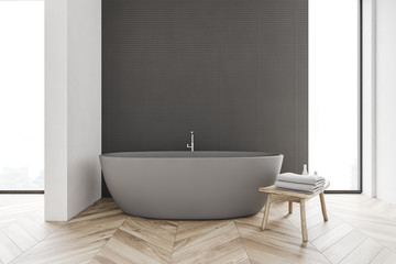 Fototapeta na wymiar Gray and white bathroom with tub