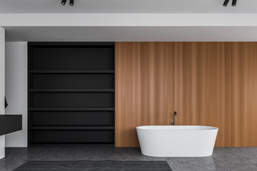 Fototapeta na wymiar Gray and wooden bathroom with tub and shelves