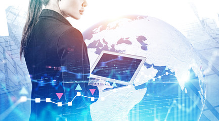 Woman with laptop in city, global trade