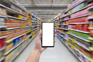 Man Hand Holding Using Smartphone in supermarket