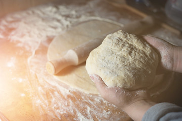 Beautiful photo of hands with dough and flour