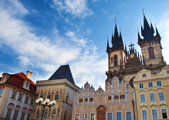 Fototapeta premium View of the sharp towers of the Church of Mother of God before Týn and houses