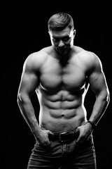 Portrait of a athletic muscular bearded man posing