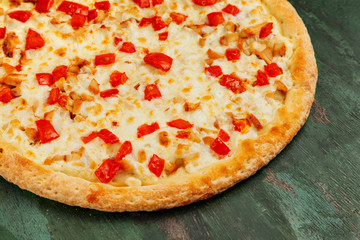 Fresh and tasty italian pizza on wooden background