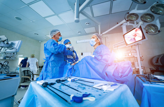 Team surgeon at work in operating room. Modern equipment in operating room. Medical devices for neurosurgery.