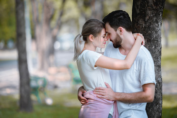 Young couple lover dating and hugging in love at spring garden park, copy space, Romantic love concept.