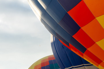 Balloons on the ground. Balloonists prepare the balloons for flight. Festival of aeronautics.