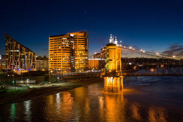 Fototapeta premium Aerial night photo bridge lit with starry sky John Roebling