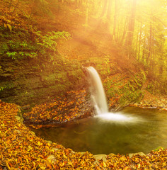 Fototapeta na wymiar Autumn mountain waterfall
